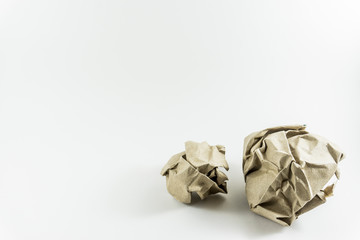 Brown crumpled paper isolated on white background.