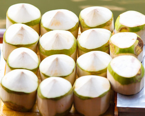 Fresh coconuts at Damnoen Saduak floating market in Ratchaburi near Bangkok, Thailand