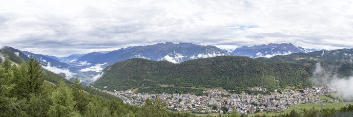 Fototapeta na wymiar Panoramic view of Aprica town and the Bergamasque Alps
