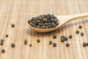 Black pepper, Close-up black pepper on a wood spoon