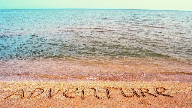 Inscription on adventure sand.