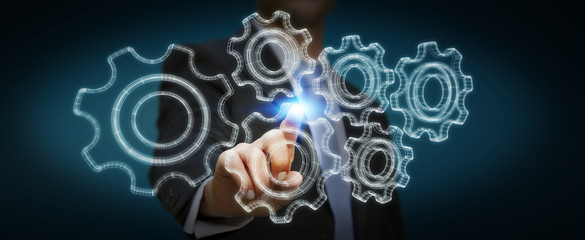 Businessman holding digital 3D engine