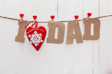 The message for Father's Day from cardboard letters hanging on c