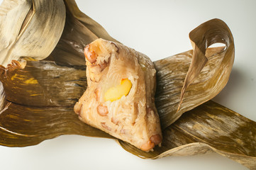Zongzi (pyramid-shaped dumplings made by wrapping glutinous rice in bamboo leaves)