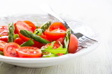 Fresh salad with cherry tomatoes and asparagus