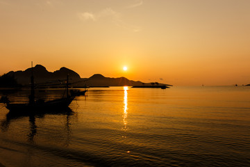 Boats on the beach with the sunset.Beautiful natural seascape