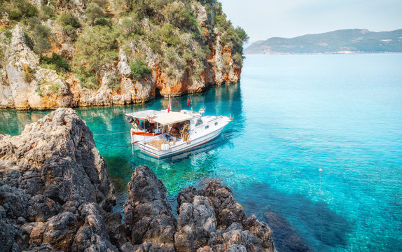 Fishing boat at mediterranean sea in cosy bay.