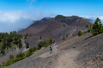 Poster Man and woman running on volcanic trail, La Palma, Spain © fschuetz