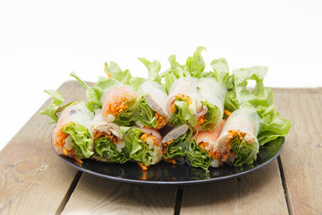 Salad roll in dish.