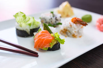 Sushi set with chopsticks on the plate