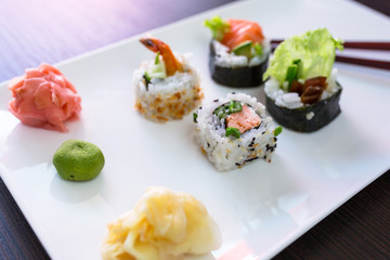 Sushi set with chopsticks on the plate