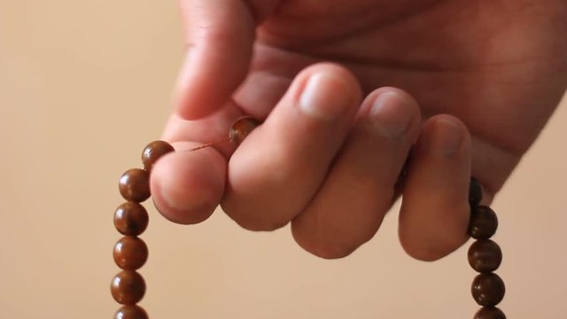prayer beads in hand