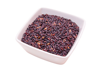 Black rice on a square bowl on white background
