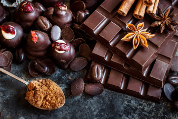 Assortment of dark and milk chocolate stack, sweets.