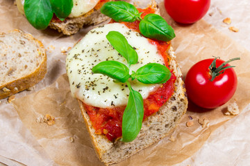 Italian bruschetta with cherry tomatoes, mozzarella & fresh basil.