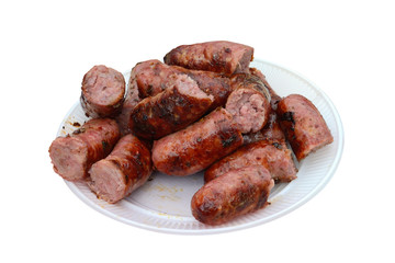smoked sausages on a plastic plate isolated on white background
