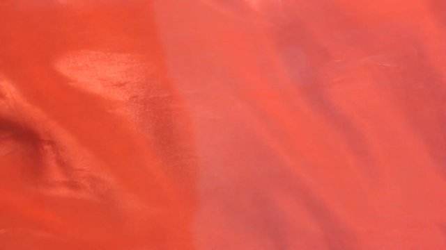 red cloth lye swaying in the wind, closeup