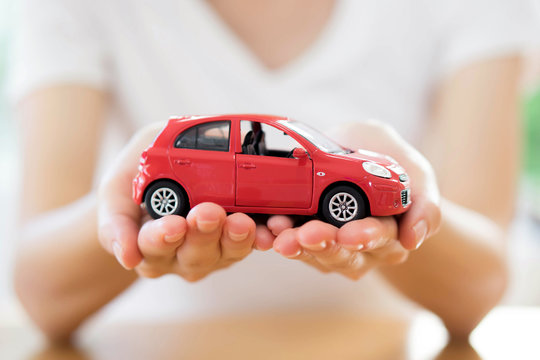 Hand with car. Auto dealership and rental concept background. Car ownership representation home product photography indoor close-up personal finance concept