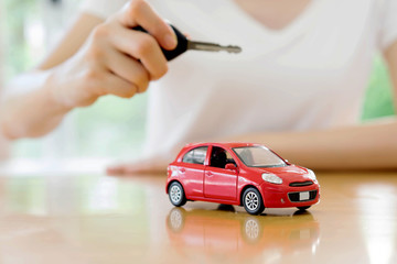 small car and key for car, car leasing and car loan concept