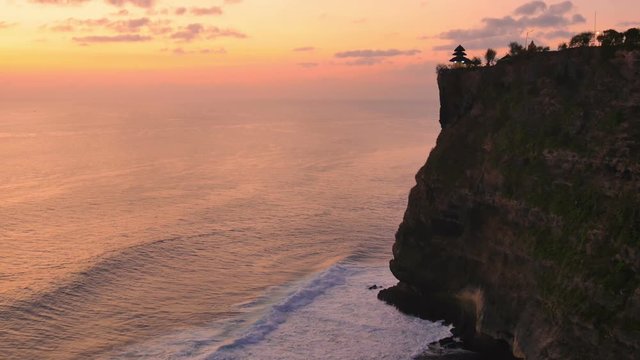 bali landmark sea temple uluwatu at dusk lying on a big cliff