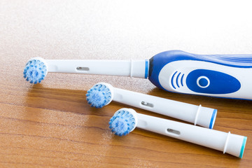 Electronic toothbrush with toothbrush heads on white
