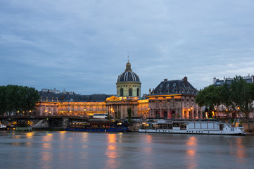 Fototapeta premium The French Institute and the Seine river at night