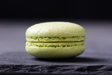 Colorful French Macarons on the slate stone background