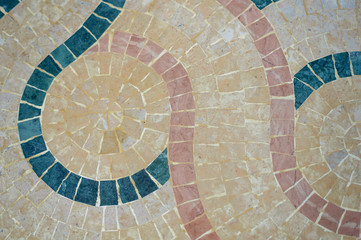 Fragment of artistic handmade tiles design background, closeup top view