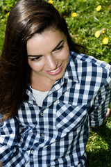 portrait of a beautiful girl on sunny meadow