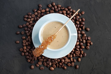 ?up of espresso with sugar stick and coffee beans