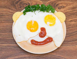 funny faces from eggs with cheese and sauce