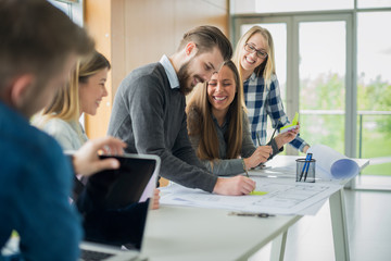 Group of happy architects at their office