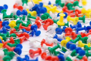 one yellow pin put on floor in many colors pin,different Concept