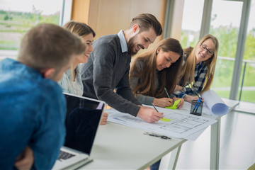 Group of happy architects at their office