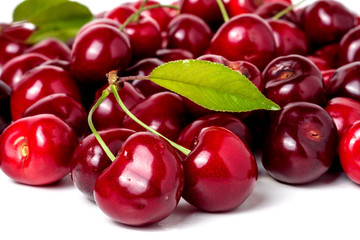 red cherry with leaf isolated on white background