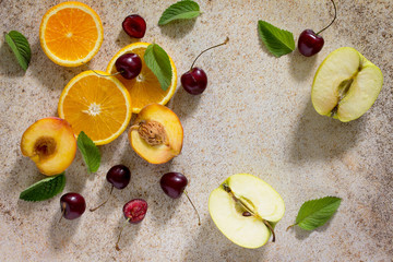 Colorful pattern of fruit, mint leaves and cherries.