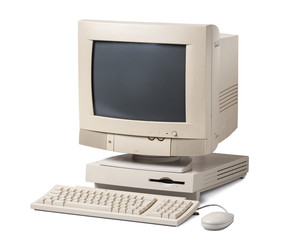Old personal computer. The system unit, CRT monitor, keyboard and mouse isolated on white...