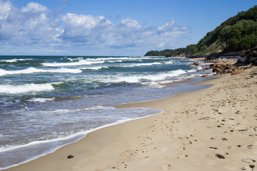 Big waves with foam on sea coast