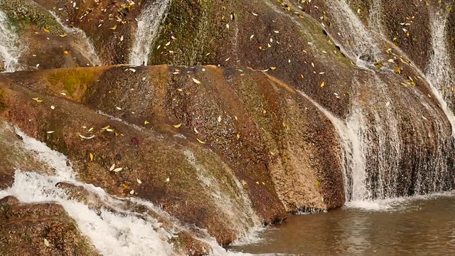 Waterfall and Pagoda near Pyin Oo Lwin in Myanmar slow motion