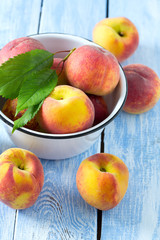 ripe peaches on wooden surface