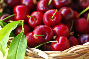 red cherry fruit in basket