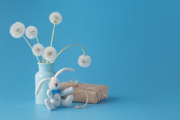 Mothers day congratulation with gift box and dandelions