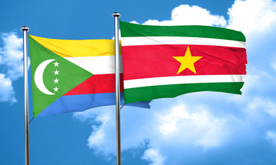 Comoros flag with Suriname flag, 3D rendering