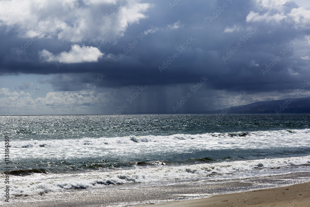 Wall mural Pacific ocean during a storm. Beach landscape in the U.S. in bad weather. The ocean and waves during strong winds in United States, Santa Monica.