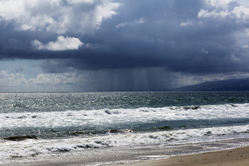 Pacific ocean during a storm. Beach landscape in the U.S. in bad weather. The ocean and waves during strong winds in United States, Santa Monica.