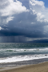 Pacific ocean during a storm. Beach landscape in the U.S. in bad weather. The ocean and waves during strong winds in United States, Santa Monica.