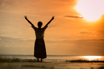 Happiness woman and sunlight of sunset