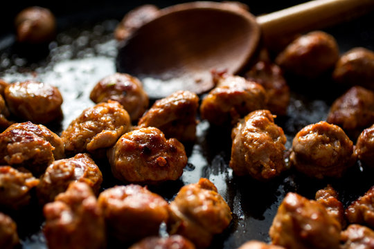 Wooden Spoon Stirring Meat In Pan