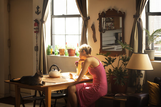 Young woman sitting at table