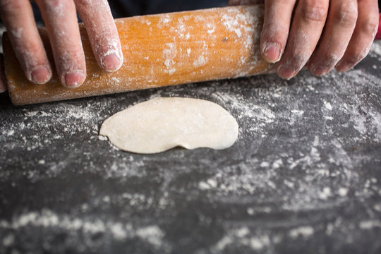 Person using rolling pin to make pastry
